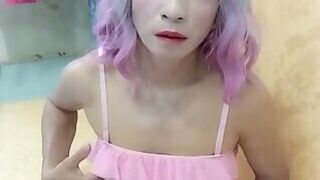 Oanh Le transgender wearing sexy porn clothes playing anal with an artificial cock is happy